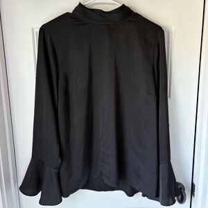 Super cute silky top that can be dressed up or dressed down!